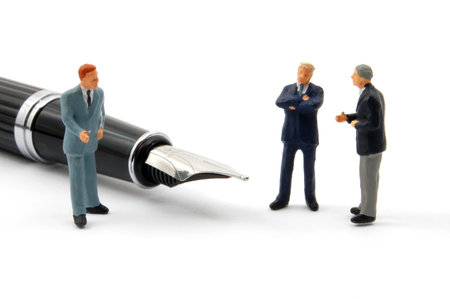 business man and pen isolated on white backgroundの写真素材