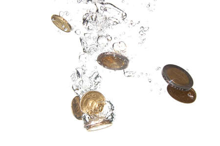 money in water with bubbles on white backgroundの写真素材