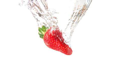 strawberry splash in water showing a fitness conceptの写真素材