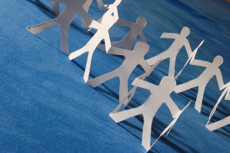 paper people doing teamwork in their businessの写真素材