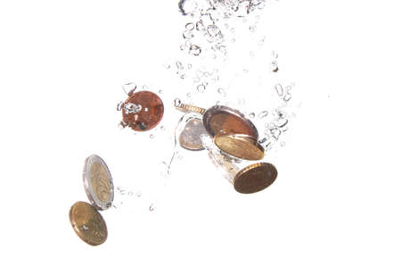 money in water with bubbles on white backgroundの写真素材