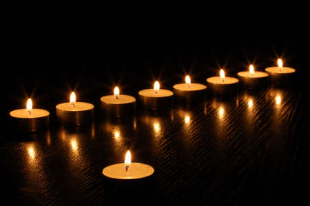 romantic hot candle light on black backgroundの写真素材