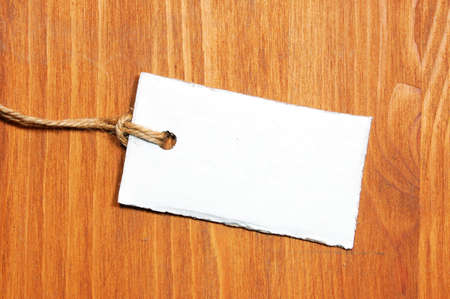 blank price tag with copyspace on a wood textureの写真素材