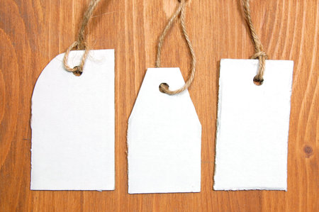 blank price tag with copyspace on a wood textureの写真素材