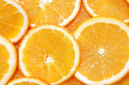 healthy orange fruit background with sliced oranges 