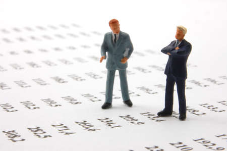 business man over economic chart in conversationの写真素材