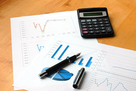 business still life with coffee and chart showing success 