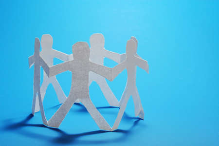 concept for friendship friends team teamwork love and help with paper manの写真素材