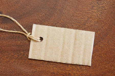 blank price tag with copyspace on woodの写真素材