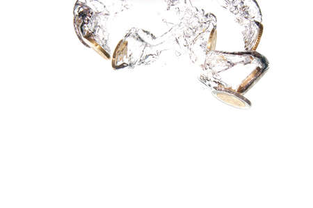 money in water with bubbles on white backgroundの写真素材