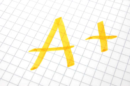 mark A plus showing positive success at schoolの写真素材