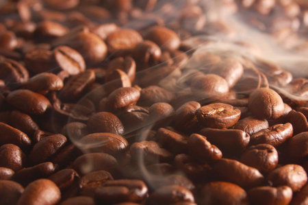 roasting coffee beans with steam and smoke