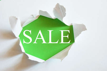 sale concept with hole in blank paperの写真素材