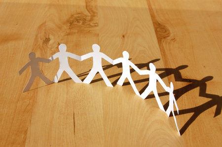 teamwork love help and family concept with paper manの写真素材