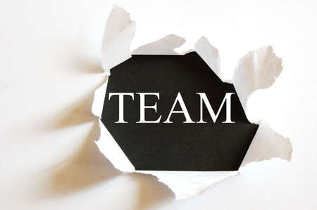 teamwork concept with a hole in white paperの写真素材
