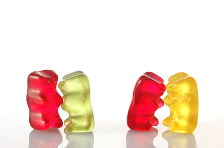 sweet gummy bears dancing on a party on white backgroundの写真素材