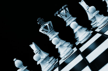 chess pieces showing power competition conflict and strategy in business