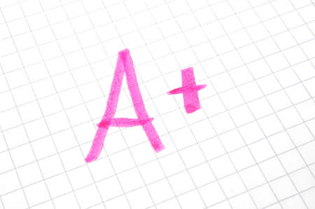 mark A plus showing positive success at schoolの写真素材