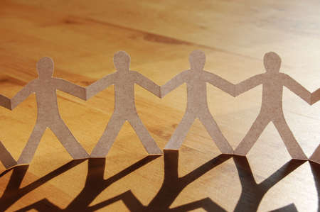 paper man showing concept for business teamwork and loveの写真素材