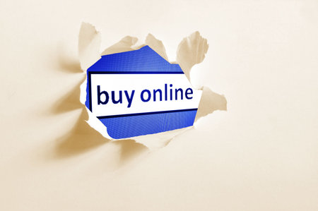 internet concept behind hole in blank paper                  の写真素材