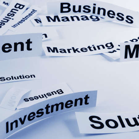 management concept with business elements on sheets of paperの写真素材