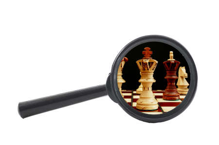 business competition concept with chess pieces and magnifying glass                                    の写真素材