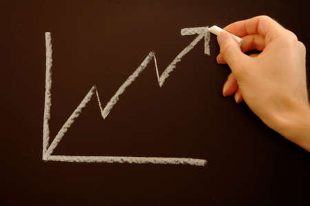 financial graph on chalkboard showing business success and growth                                    の写真素材