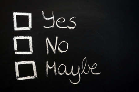 vote yes or no written on chalkboard or blackboard                                    の写真素材