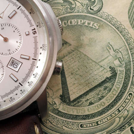 money and watch showing business time concept                                    の写真素材