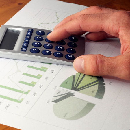 business chart graph or diagram and hand on desktop                                    の写真素材