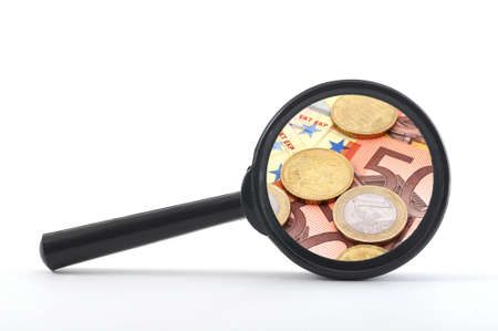 money and magnifying glass showing financial success                                    の写真素材