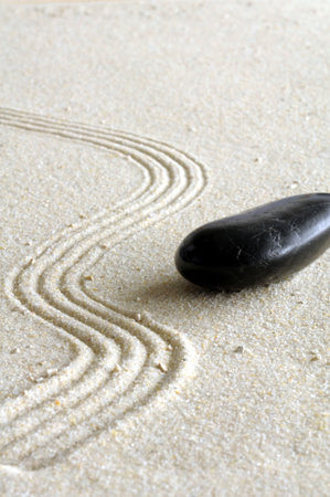 zen still life with sand and green leaf showing wellness conceptの写真素材