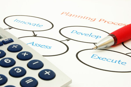 analysing business plan with pan an paper in the office                                    