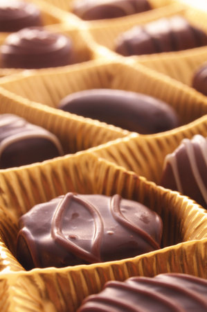 chocolate candy or sweets in golden gift box for birthday present                                   ...