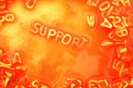 support or help concept with red pasta snackの写真素材
