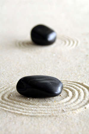 zen garden with sand stones and copyspace for a text messageの写真素材