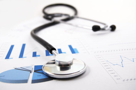 stethoscope on medical data chart in hospitalの写真素材
