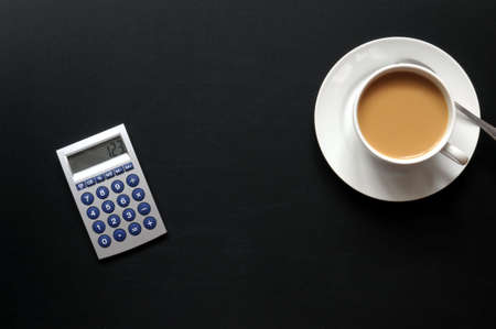 coffee break concept with mug on black  desk in business officeの写真素材
