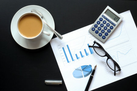 financial data and phone showing business success concept