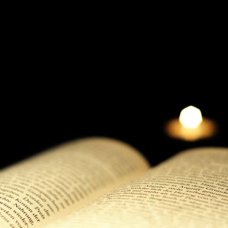 reading a book and copyspace on blackの写真素材