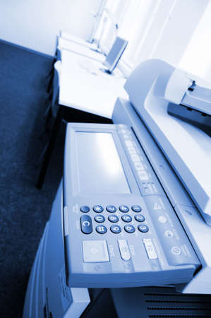 copier center or desktop in office showing paperwork conceptの写真素材