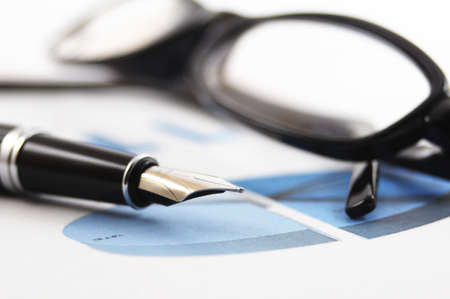 business or finance still life with pen and chartの写真素材