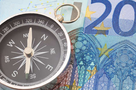 euro money and compass showing financial successの写真素材