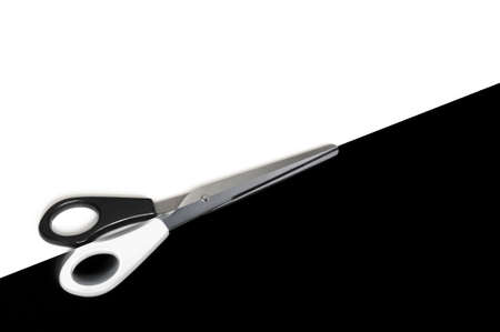 scissors cutting or dividing a black and white copyspace areaの写真素材