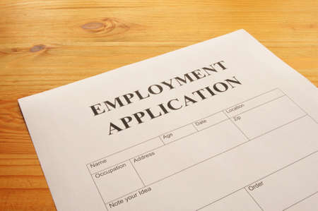 employment application form on desk showing job search conceptの写真素材