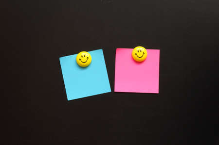 smiley and blank sheet note paper with copyspace の写真素材
