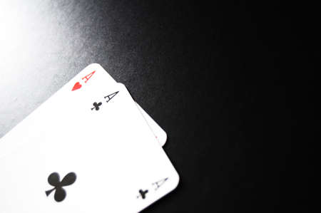 card game with aces on black backgroundの写真素材