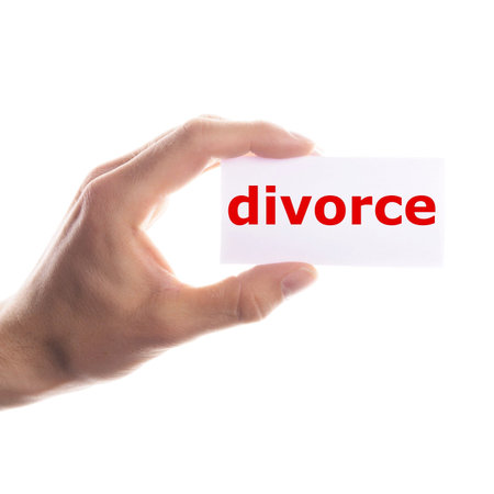 divorce concept with hand holding paper signの写真素材
