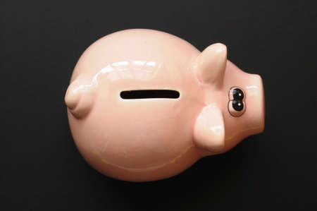 piggy bank and blank or empty black copyspaceの写真素材