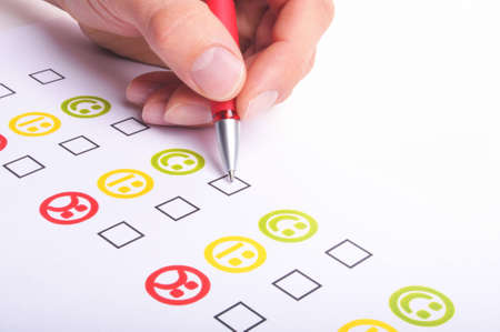 hand pen and checkbox or tickbox with smilieの写真素材